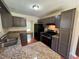 Functional kitchen with granite countertops and stainless steel appliances at 120 Squirrel Way, Atlanta, GA 30349