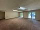 Expansive living area with lots of natural light coming through sliding glass doors overlooking the yard at 120 Squirrel Way, Atlanta, GA 30349