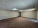 Open living area with neutral carpet and paint, suitable for versatile interior design options at 120 Squirrel Way, Atlanta, GA 30349