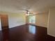 Spacious main bedroom with hardwood floors and a ceiling fan at 120 Squirrel Way, Atlanta, GA 30349