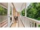 Inviting balcony with white railings overlooking lush greenery, accessible from the main bedroom at 3532 Paces Nw Pl, Atlanta, GA 30327