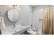 Cozy bathroom featuring a shower-tub combo with tile surround, and a modern vanity at 3532 Paces Nw Pl, Atlanta, GA 30327
