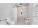 Elegant bathroom featuring a walk-in shower with marble tiling and a neutral color palette at 3532 Paces Nw Pl, Atlanta, GA 30327