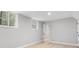 Bedroom featuring hardwood floors, neutral paint, and natural light from two windows at 3532 Paces Nw Pl, Atlanta, GA 30327