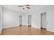 Neutral bedroom featuring hardwood floors, walk-in closet, ceiling fan and natural light at 3532 Paces Nw Pl, Atlanta, GA 30327