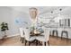 Elegant dining room featuring a modern chandelier and open access to the kitchen at 3532 Paces Nw Pl, Atlanta, GA 30327