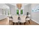 Elegant dining room featuring a modern chandelier and open access to balcony at 3532 Paces Nw Pl, Atlanta, GA 30327