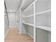 Hallway with hardwood floors and built-in shelving at 3532 Paces Nw Pl, Atlanta, GA 30327