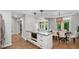Spacious kitchen with an island, stainless steel appliances, and an adjacent dining area with natural light at 3532 Paces Nw Pl, Atlanta, GA 30327