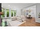 Open-concept living room with hardwood floors and access to the outside at 3532 Paces Nw Pl, Atlanta, GA 30327