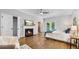 Spacious main bedroom with a fireplace, ceiling fan, ensuite bath, and doors to a private deck at 3532 Paces Nw Pl, Atlanta, GA 30327