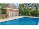 Community pool at townhome with brick changing rooms and ample space to relax at 3532 Paces Nw Pl, Atlanta, GA 30327