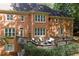 Charming brick home featuring a spacious deck and plenty of natural light at 5040 Harrington Rd, Johns Creek, GA 30022