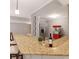 Basement bar featuring granite countertops, seating, stainless steel appliances, and a convenient serving area at 5040 Harrington Rd, Johns Creek, GA 30022