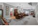 Inviting basement living area featuring a bar, brick fireplace, comfortable seating, and neutral decor for relaxation at 5040 Harrington Rd, Johns Creek, GA 30022