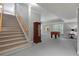 Spacious finished basement with stairs, a foosball table, and neutral decor perfect for entertaining or relaxing at 5040 Harrington Rd, Johns Creek, GA 30022