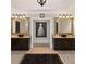 Modern bathroom showcasing double vanity sinks, elegant mirrors, and stylish decor at 5040 Harrington Rd, Johns Creek, GA 30022