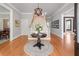 Inviting foyer with hardwood floors, staircase, elegant lighting, and neutral wall colors at 5040 Harrington Rd, Johns Creek, GA 30022