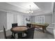 Spacious game room with a pool table, a poker table, and recessed lighting under a tray ceiling at 5040 Harrington Rd, Johns Creek, GA 30022