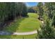 Beautiful aerial view of the golf course showcasing the fairway and surrounding trees at 5040 Harrington Rd, Johns Creek, GA 30022
