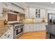 Well-equipped kitchen with stainless steel appliances, custom cabinetry, and granite countertops at 5040 Harrington Rd, Johns Creek, GA 30022