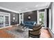Elegant living room with natural light, hardwood floors, a comfortable sofa and designer touches at 5040 Harrington Rd, Johns Creek, GA 30022