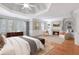 Bright main bedroom with sitting area, fireplace, and windows with shutters at 5040 Harrington Rd, Johns Creek, GA 30022