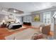 Spacious main bedroom features a decorative ceiling, fireplace, and seating area at 5040 Harrington Rd, Johns Creek, GA 30022
