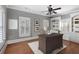 Inviting office with hardwood floors, plantation shutters, built-in shelving, and a cozy work space at 5040 Harrington Rd, Johns Creek, GA 30022