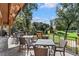 Outdoor patio with comfortable seating offers a great view of the golf course at 5040 Harrington Rd, Johns Creek, GA 30022