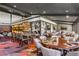 Upscale restaurant featuring stylish seating, a unique carpet and golf memorabilia at 5040 Harrington Rd, Johns Creek, GA 30022