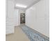 Well-organized storage area featuring custom cabinets and stylish blue accent rugs for added flair at 5040 Harrington Rd, Johns Creek, GA 30022