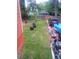 Lush backyard with a grassy area, vehicle, and some storage items visible at 1105 Oak Knoll Ter, Atlanta, GA 30315