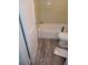 A bathroom with bathtub and wood-look flooring at 1105 Oak Knoll Ter, Atlanta, GA 30315