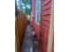 Narrow side yard showing the home's exterior, wooden fence, and gated access at 1105 Oak Knoll Ter, Atlanta, GA 30315