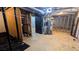 Unfinished basement with exposed pipes, hot water heater and concrete floor at 2569 Dobbs Nw Dr, Kennesaw, GA 30152