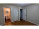 Bedroom featuring hardwood floors, closet, and ensuite bathroom at 2569 Dobbs Nw Dr, Kennesaw, GA 30152