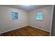 Comfortable bedroom featuring hardwood floors and well-lit windows at 2569 Dobbs Nw Dr, Kennesaw, GA 30152