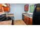 Functional kitchen featuring wooden cabinets, laminate countertops, and modern appliances at 2569 Dobbs Nw Dr, Kennesaw, GA 30152