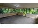 Enclosed patio has many windows offering peaceful wooded views of the property at 2569 Dobbs Nw Dr, Kennesaw, GA 30152