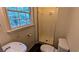 Bright bathroom featuring a shower and separate sink, a window for natural lighting, and tile flooring at 3656 Salem Trl, Lithonia, GA 30038
