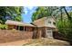 Charming two-story home with brick accents, attached garage and mature trees in a private, wooded setting at 3656 Salem Trl, Lithonia, GA 30038