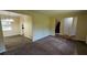 Open concept living room and dining area with neutral paint, new carpet and durable wood-look flooring at 3656 Salem Trl, Lithonia, GA 30038
