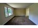 Living room with neutral paint, new carpet and large window allowing for natural light at 3656 Salem Trl, Lithonia, GA 30038
