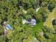 Aerial view of a house surrounded by lush green trees and forest at 4200 E Highway 166 Rd, Carrollton, GA 30116
