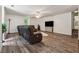 Spacious basement area with hardwood flooring and a comfortable seating arrangement at 4200 E Highway 166 Rd, Carrollton, GA 30116