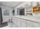 Bathroom featuring a white vanity, large mirror, natural light, and combined shower and laundry area at 4200 E Highway 166 Rd, Carrollton, GA 30116