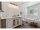 Bright bathroom with a modern vanity, marble-look tile, separate toilet and tub spaces and natural light at 4200 E Highway 166 Rd, Carrollton, GA 30116