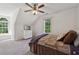 Bedroom featuring a large bed, side windows, and a dresser at 4200 E Highway 166 Rd, Carrollton, GA 30116