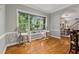 Dining area featuring hardwood floors, large windows, and a view of the outdoors at 4200 E Highway 166 Rd, Carrollton, GA 30116